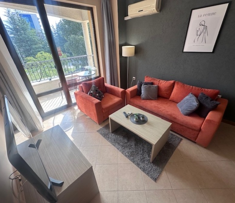 Bright living room with a balcony overlooking greenery in Royal Sun, Sunny Beach, Bulgaria.