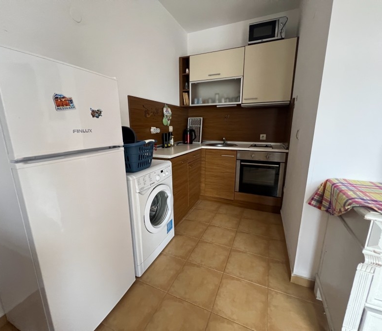 Modern kitchen in seaside apartment with mountain views, near Sunny Beach.