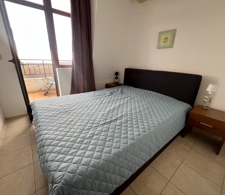 Bright bedroom with balcony overlooking the sea, pool, and mountains in Nessebar outskirts. Perfect.