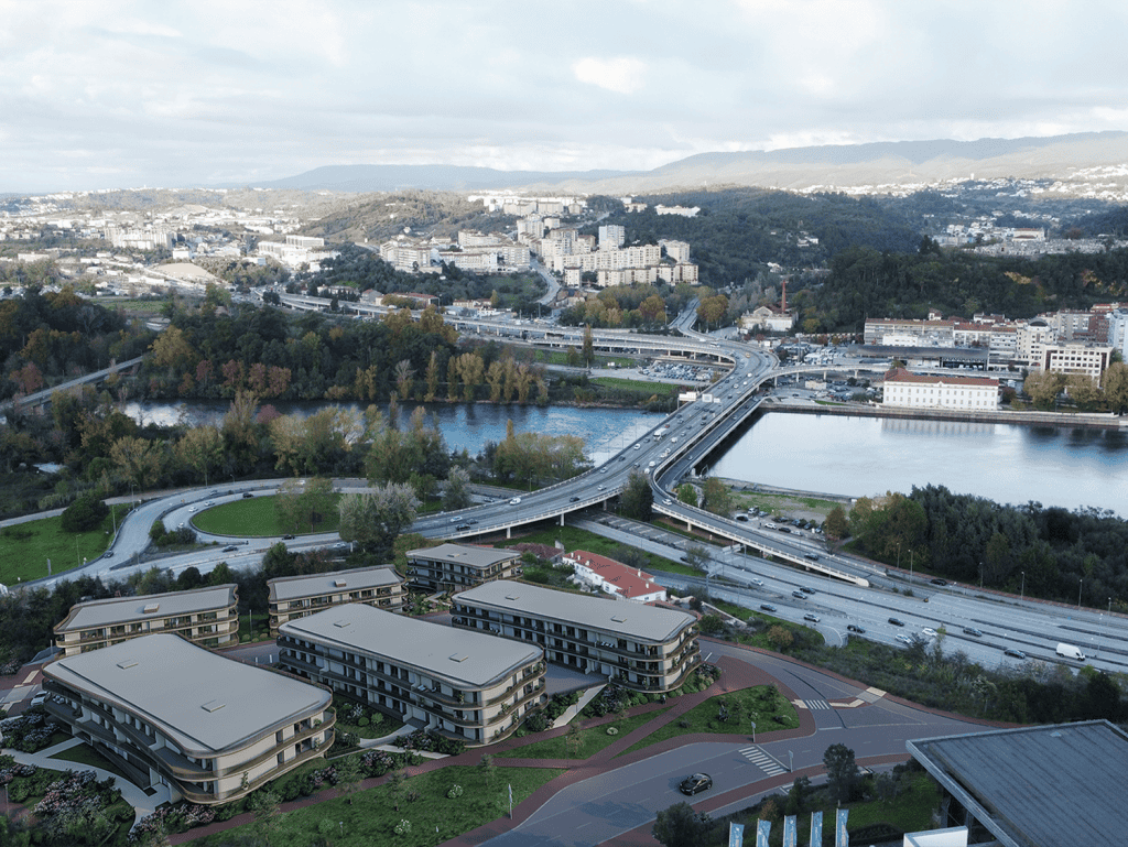 Heritage - Coimbra, Portugal: A scenic view of the city with modern apartments, bridges, and lush gr.