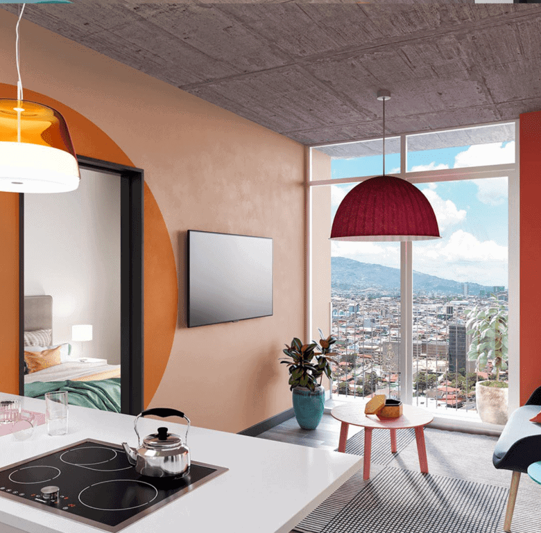 Stylish living space with vibrant decor and city views from large windows.