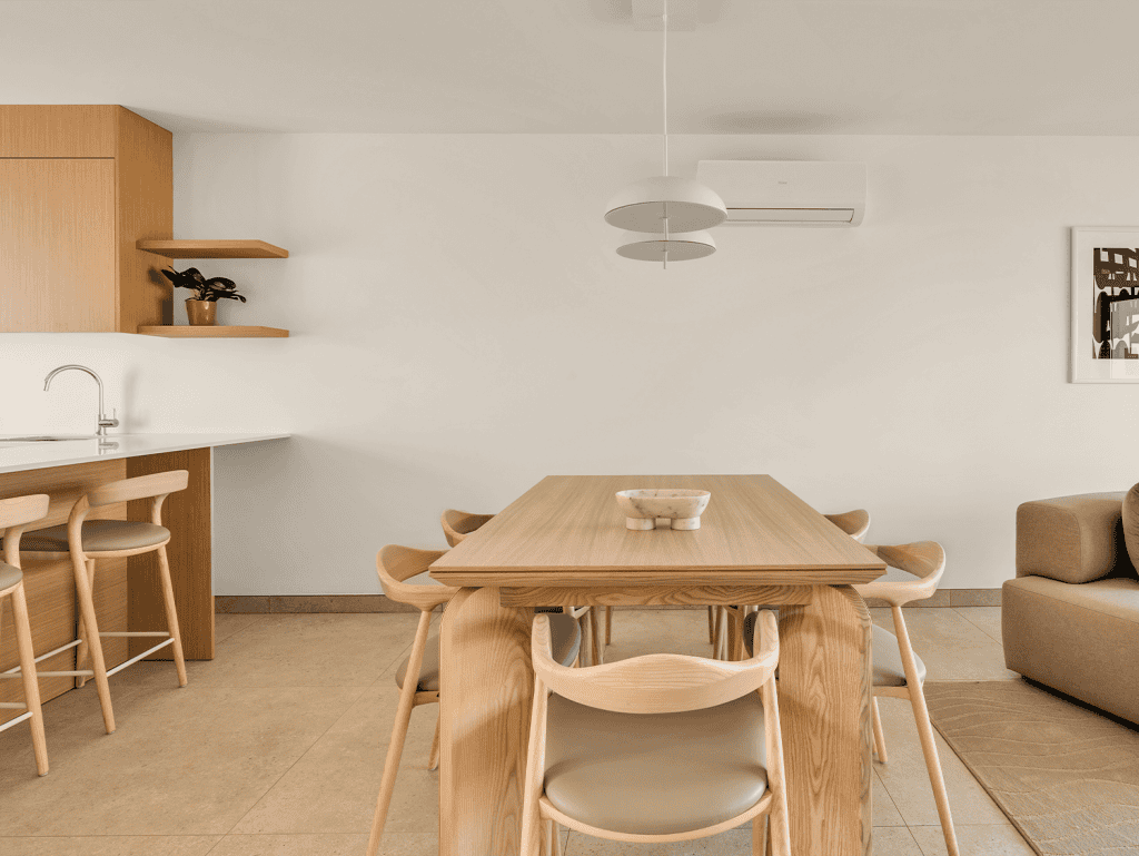 Contemporary dining room in Carvoeiro, Algarve with minimalist design and natural wood furniture.
