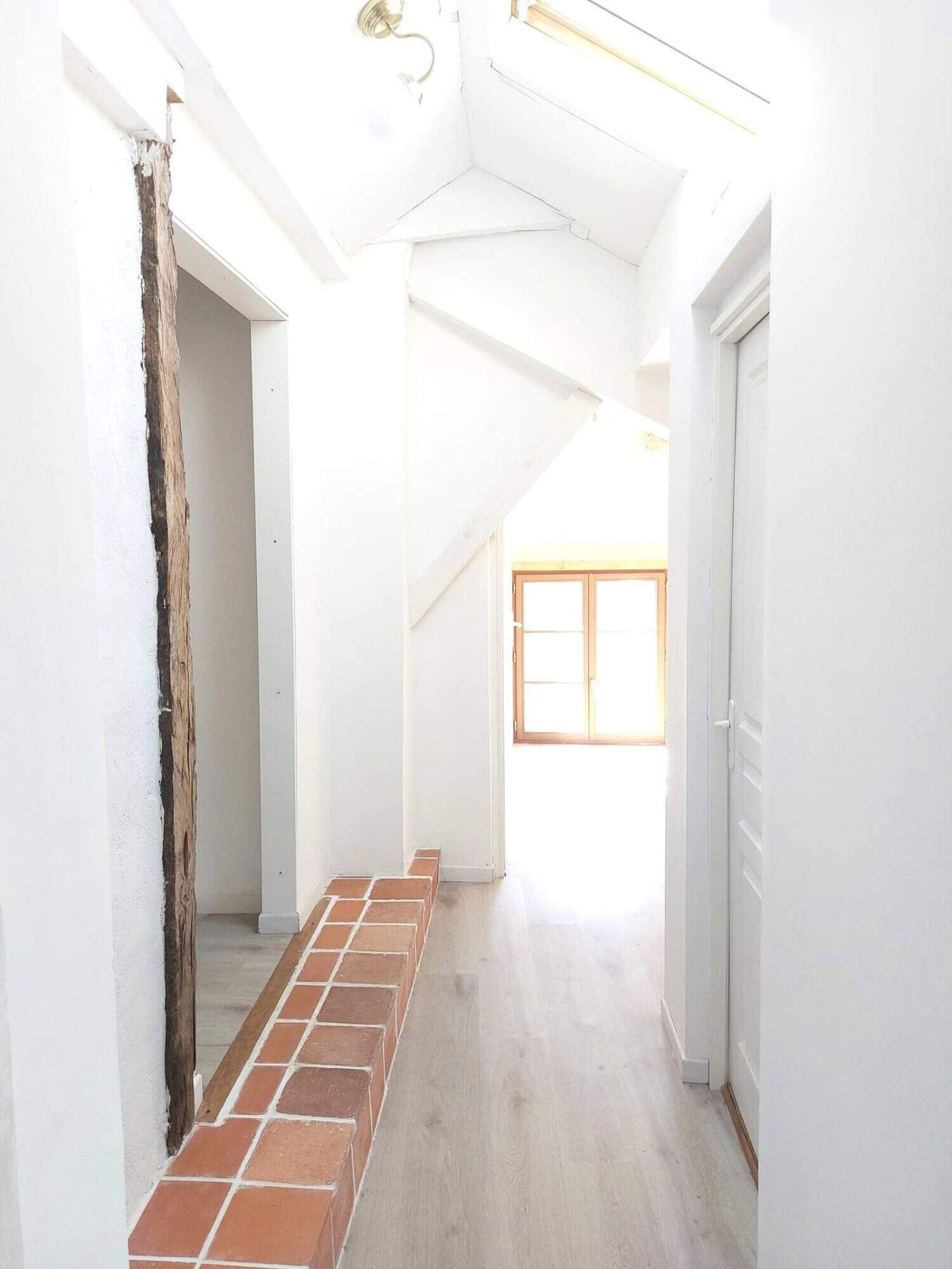 Charming Farmhouse Interior in Madiran France Bright farmhouse hallway with white walls and natural light in Madiran village, France.