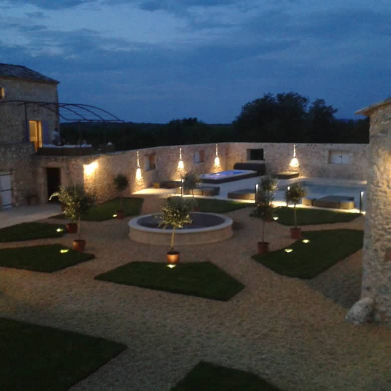 Elegant estate with landscaped gardens and outdoor lighting in Goudargues, France.