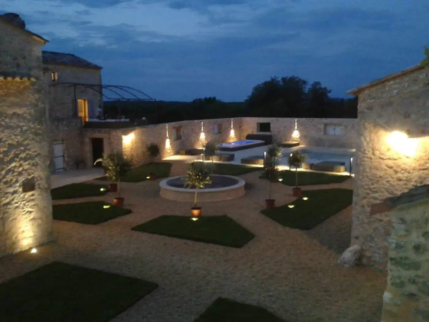 Elegant estate with landscaped gardens and outdoor lighting in Goudargues, France.