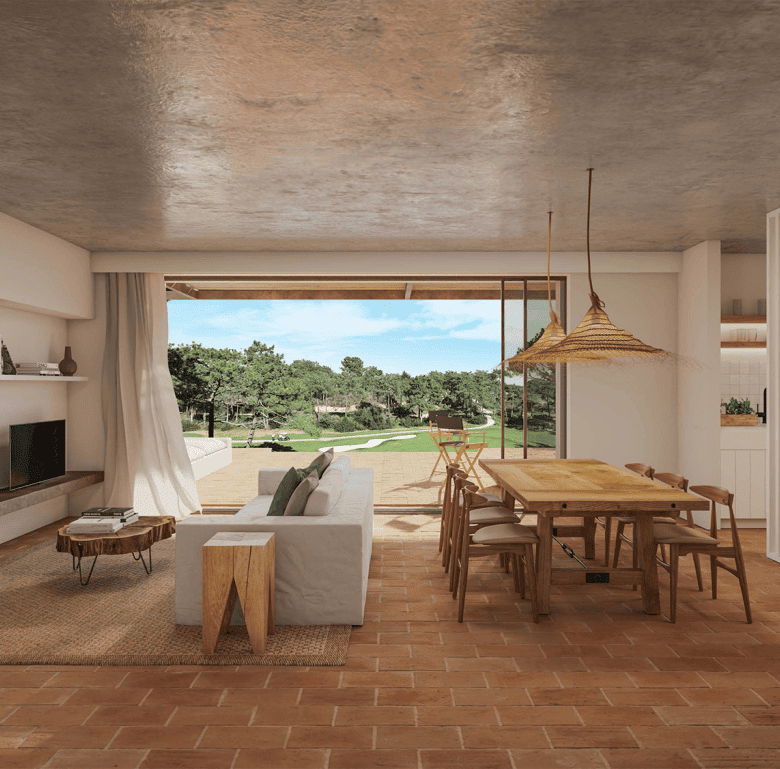 Spacious Algarve living room with large glass doors, offering a view of lush greenery and outdoor sp.
