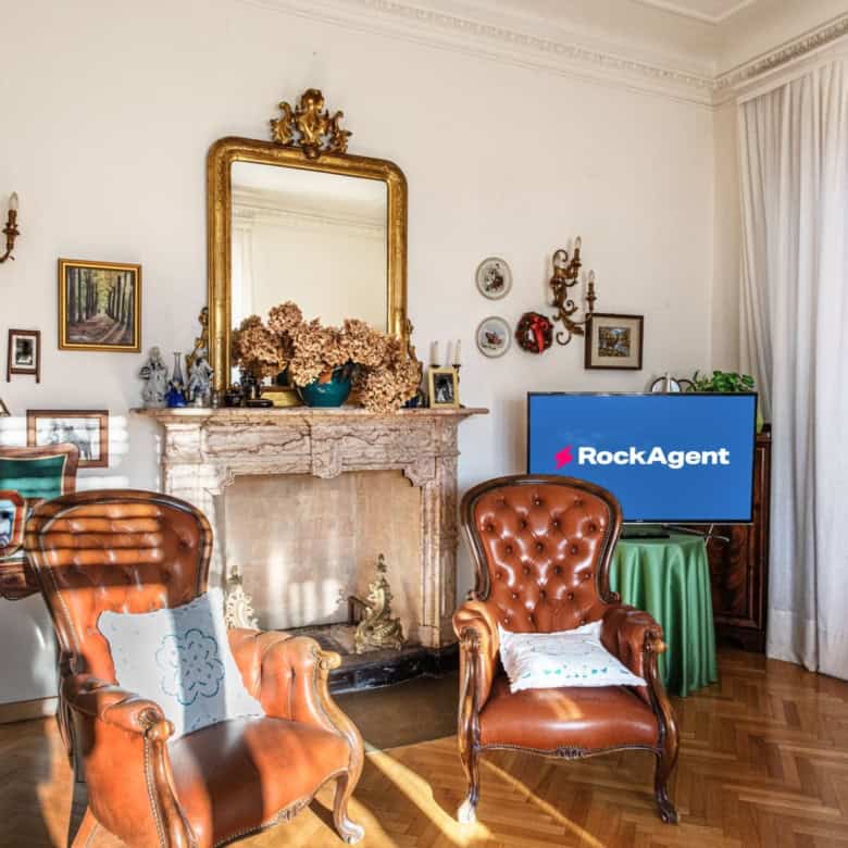 Elegant living room with vintage decor and fireplace in a luxury villa in Varzi, Italy.