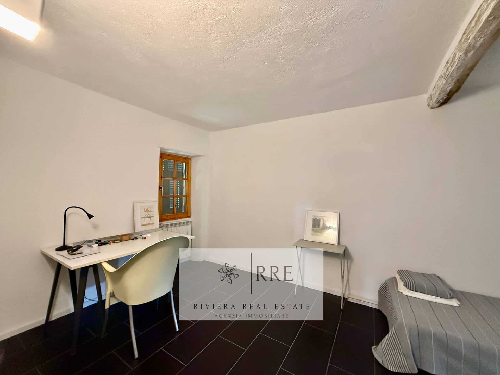 Bright home office featuring a desk, chair, and window for natural light. Ideal for remote work or s.