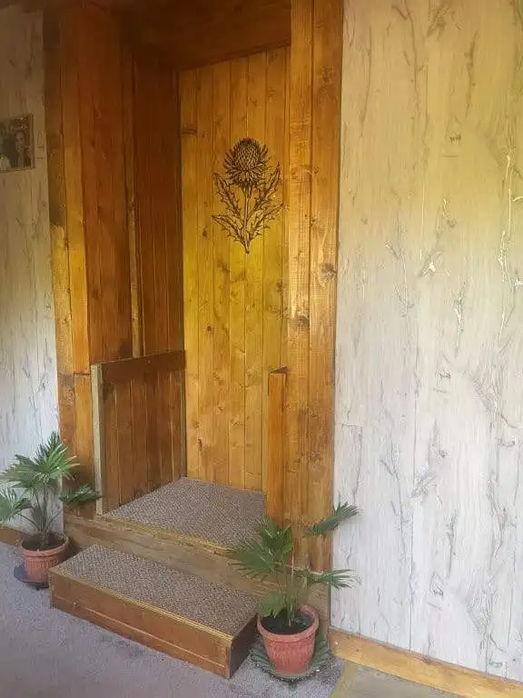 Country house entrance with wooden decor in Traykovo, Bulgaria.