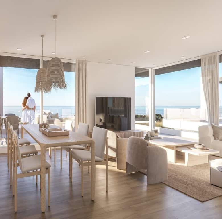 Bright interior with large windows overlooking the sea in Casa Rambla, Montevideo.