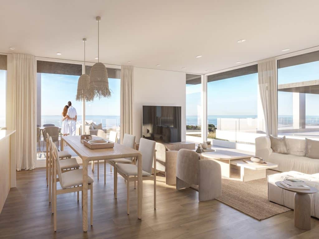 Bright interior with large windows overlooking the sea in Casa Rambla, Montevideo.