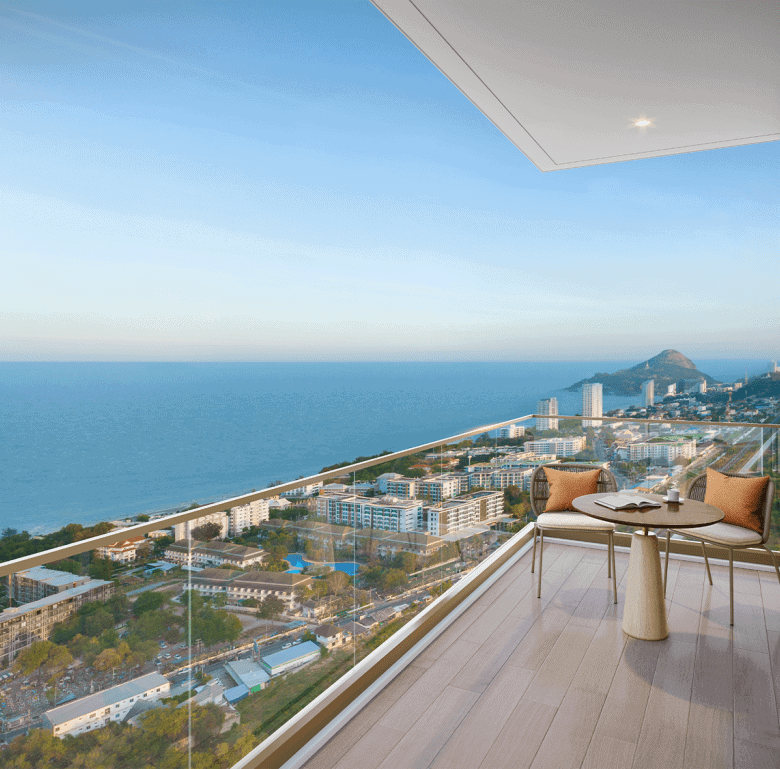 Modern balcony with sea view in Hua Hin, Thailand, overlooking the coastline and cityscape.
