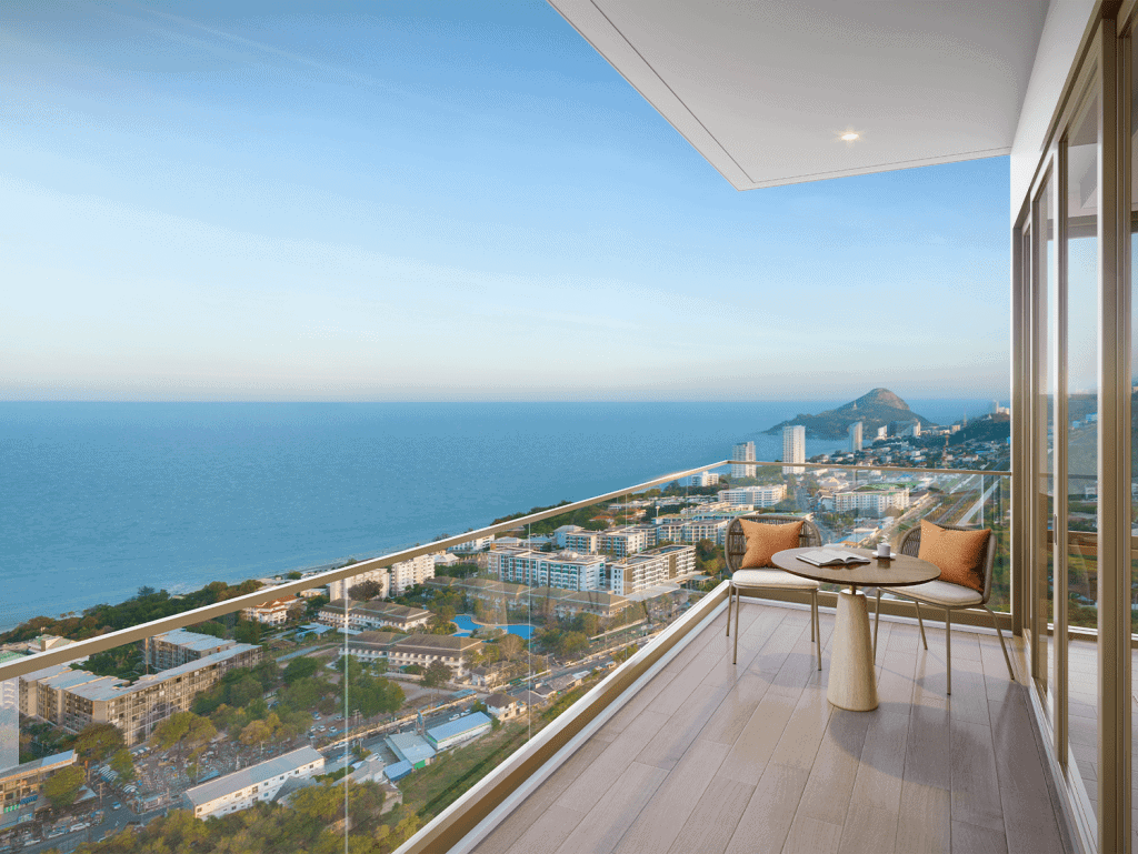 Modern balcony with sea view in Hua Hin, Thailand, overlooking the coastline and cityscape.