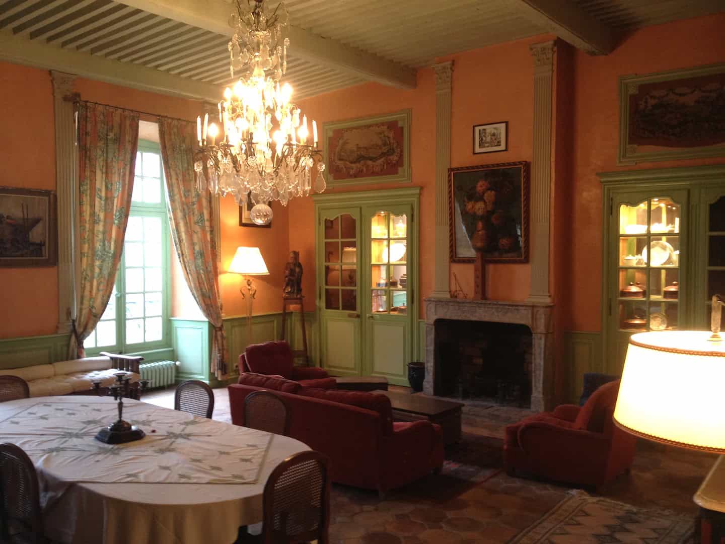 Château de la Chassaigne Bedroom Bright bedroom in Château de la Chassaigne with large window and balcony view.