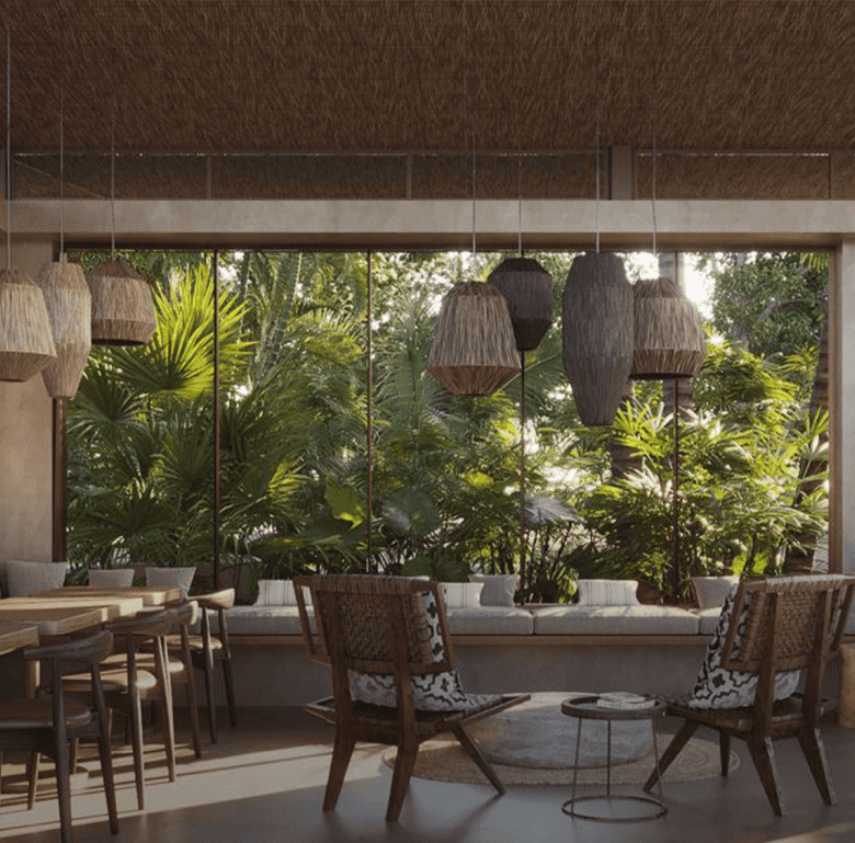 Comfortable indoor lounge with large windows and lush greenery view.