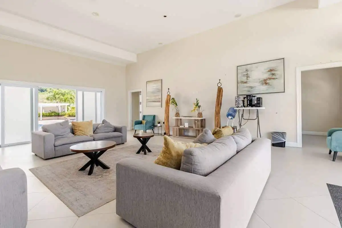 Luxury 3 Bed House Interior in Jamaica Spacious living room with modern furniture and bright natural light in Sunshine Seashore Ocean Point.