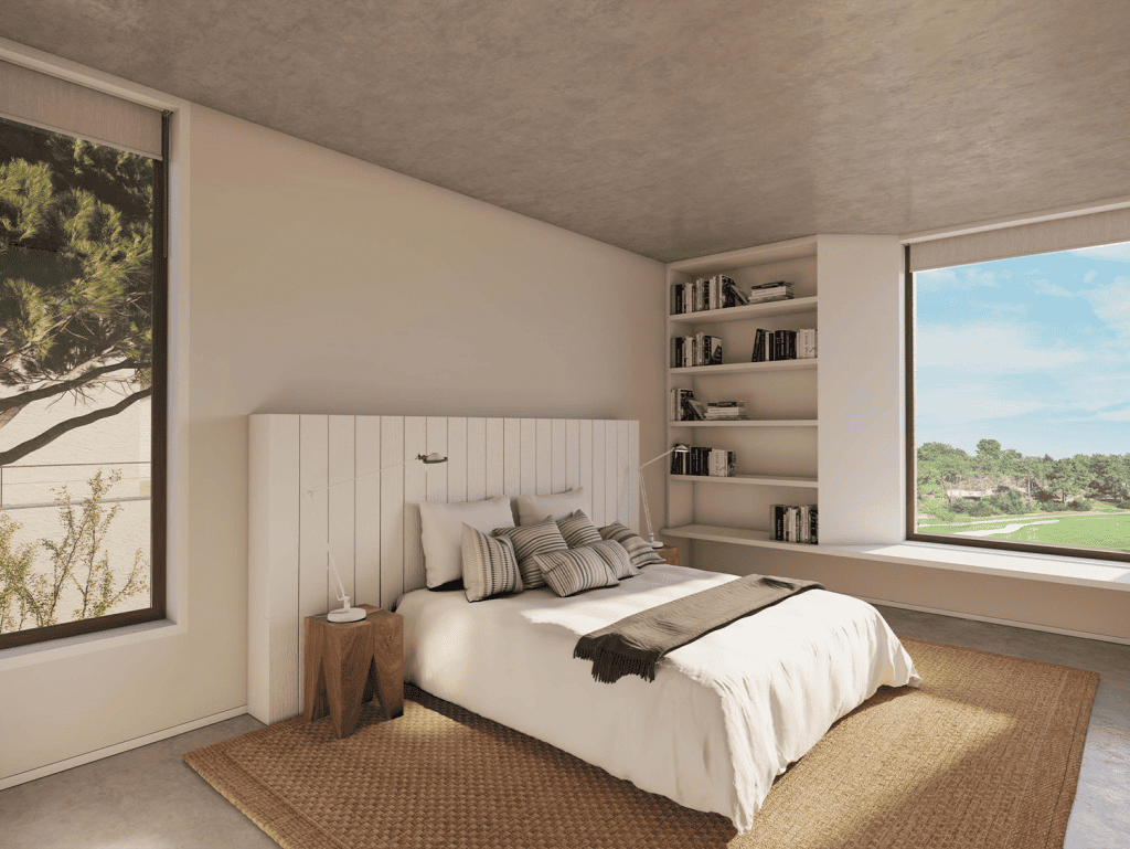 Spacious bedroom with large windows offering scenic views of Ferragudo village in Algarve.