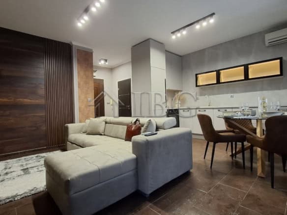 Bright living room with modern furnishings and balcony access in Nessebar.