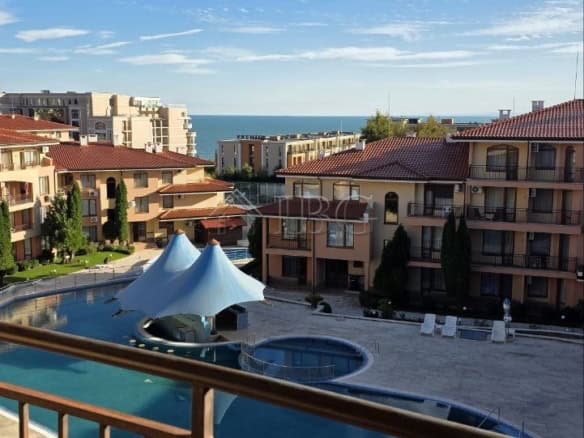 View of Panorama Dreams apartment complex with pool and sea in Sveti Vlas.