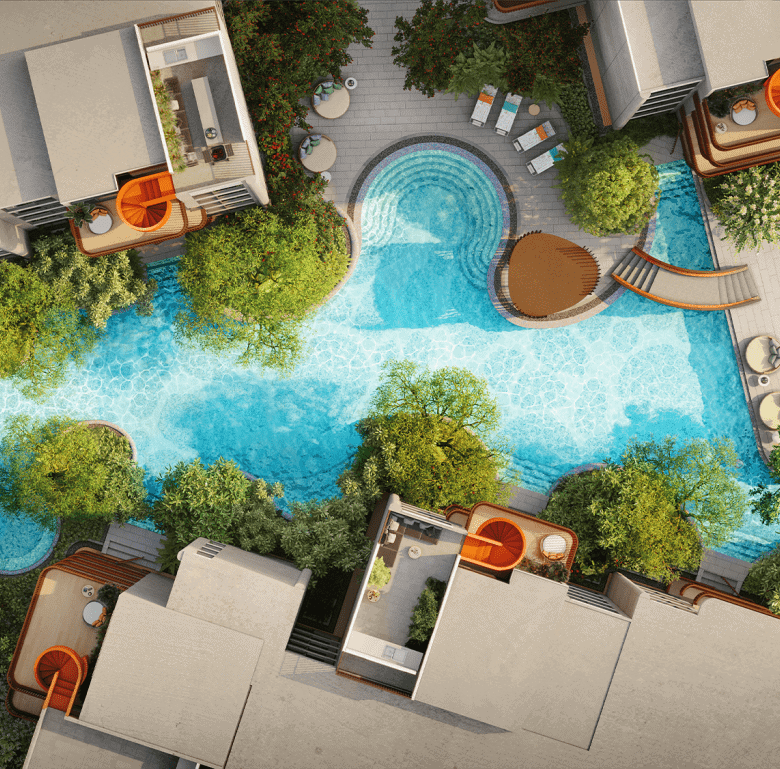 Aerial view of a luxury resort pool in Phuket, Thailand, surrounded by trees and modern accommodatio.