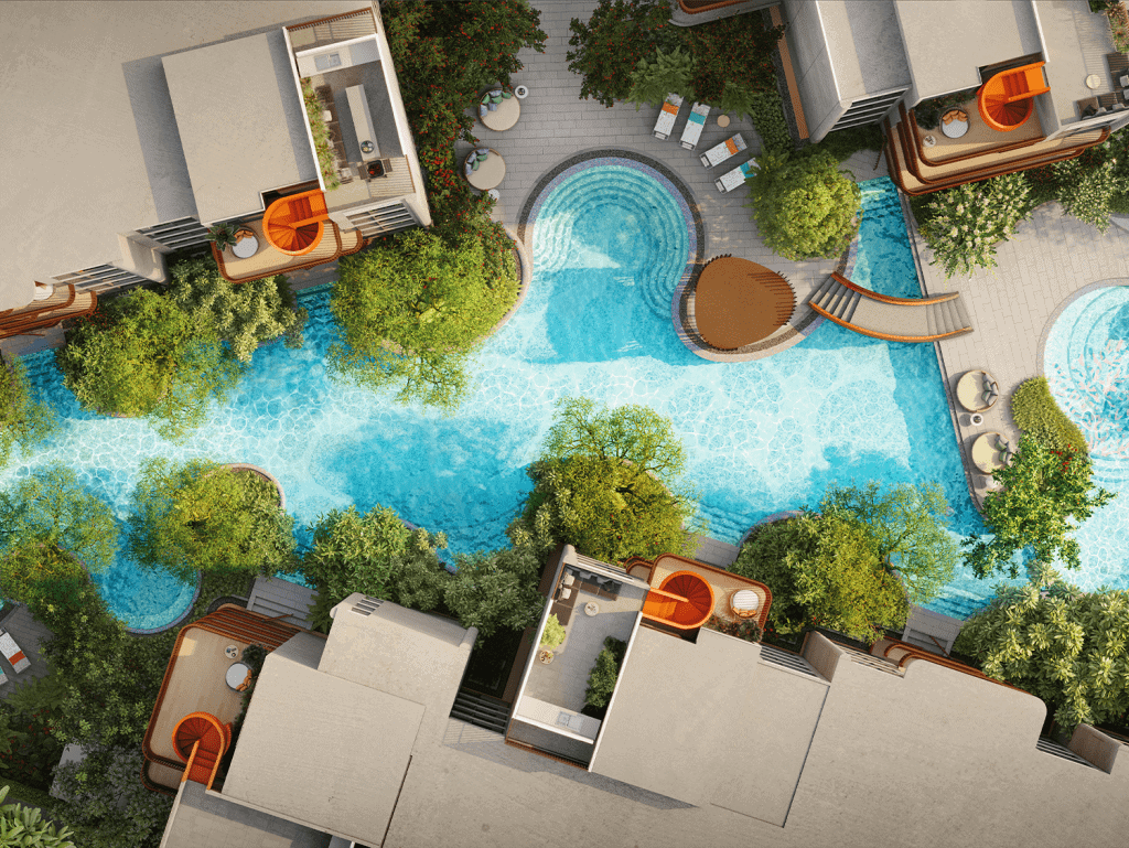 Aerial view of a luxury resort pool in Phuket, Thailand, surrounded by trees and modern accommodatio.
