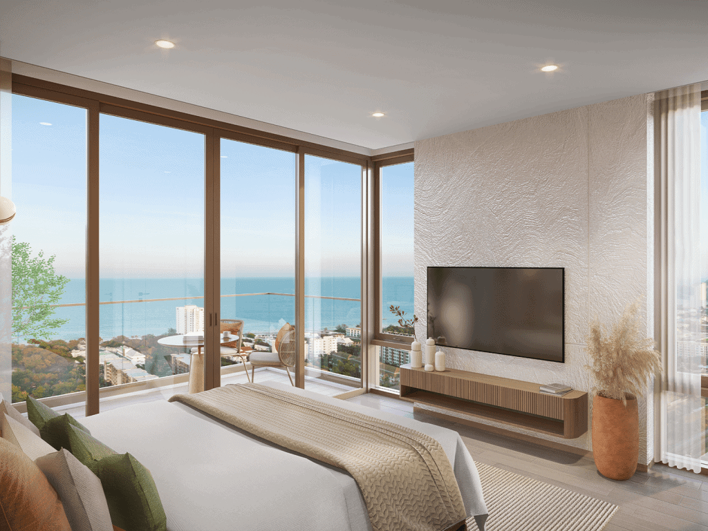 Luxurious living room with panoramic ocean views and floor-to-ceiling windows in Hua Hin, Thailand.