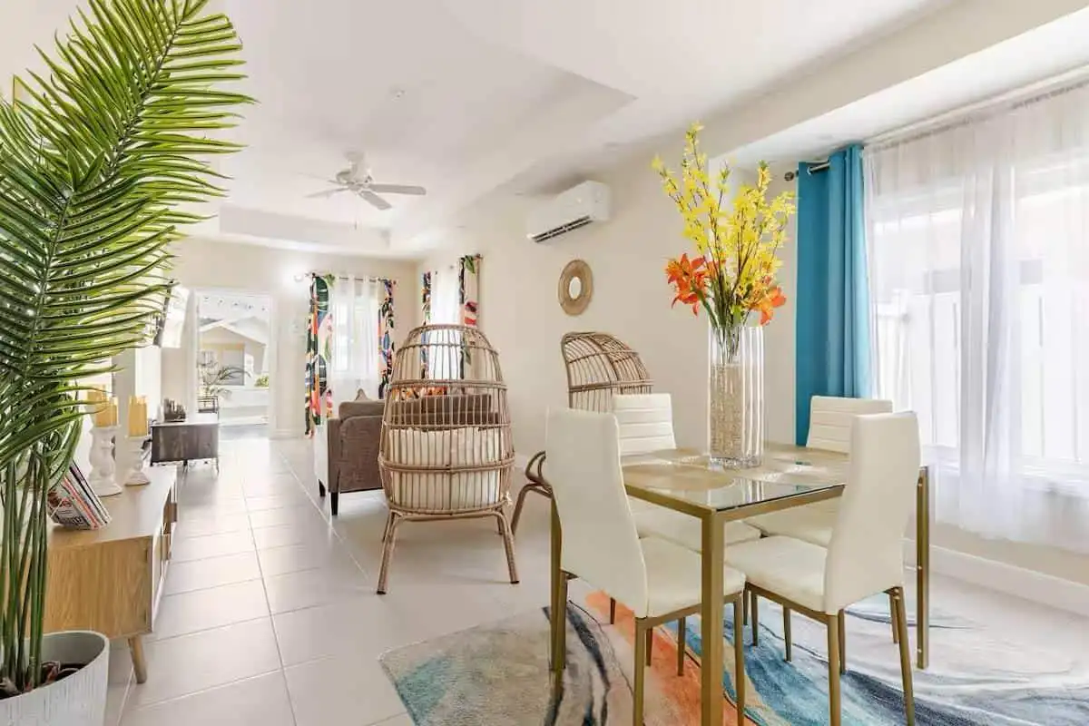 Luxury 3-Bed House in Jamaica Spacious living and dining area in a luxury 3-bedroom house at Sunshine Seashore Ocean Pointe, Lucea.
