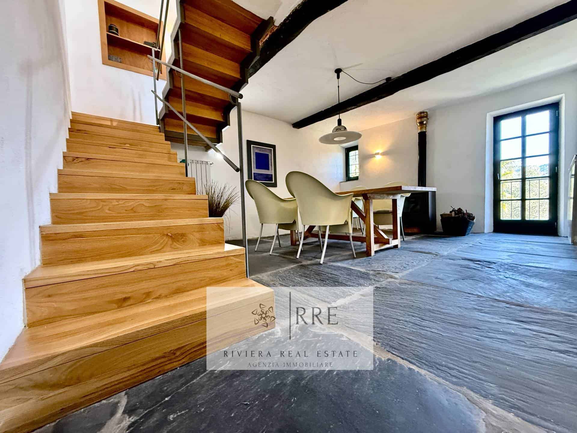 Bright interior featuring wooden stairs and contemporary decor.