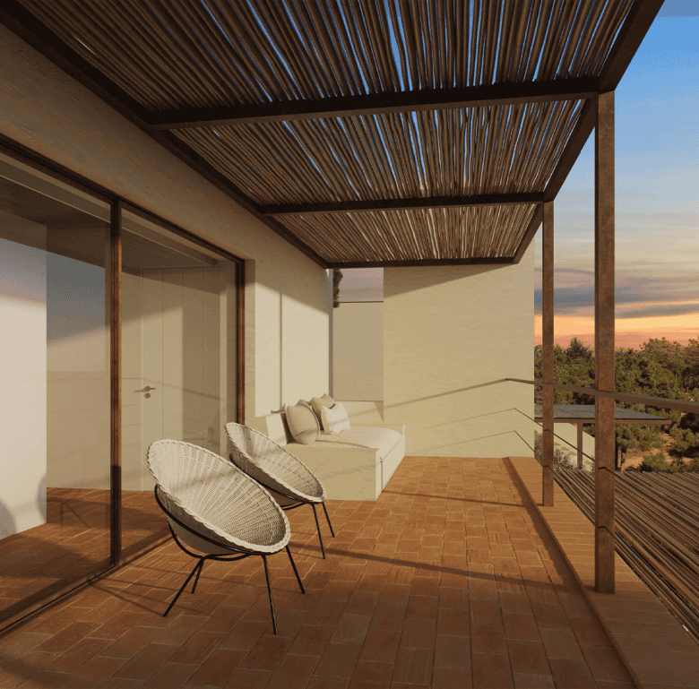 Balcony with outdoor chairs and sofa overlooking Ferragudo village in Algarve, Portugal.