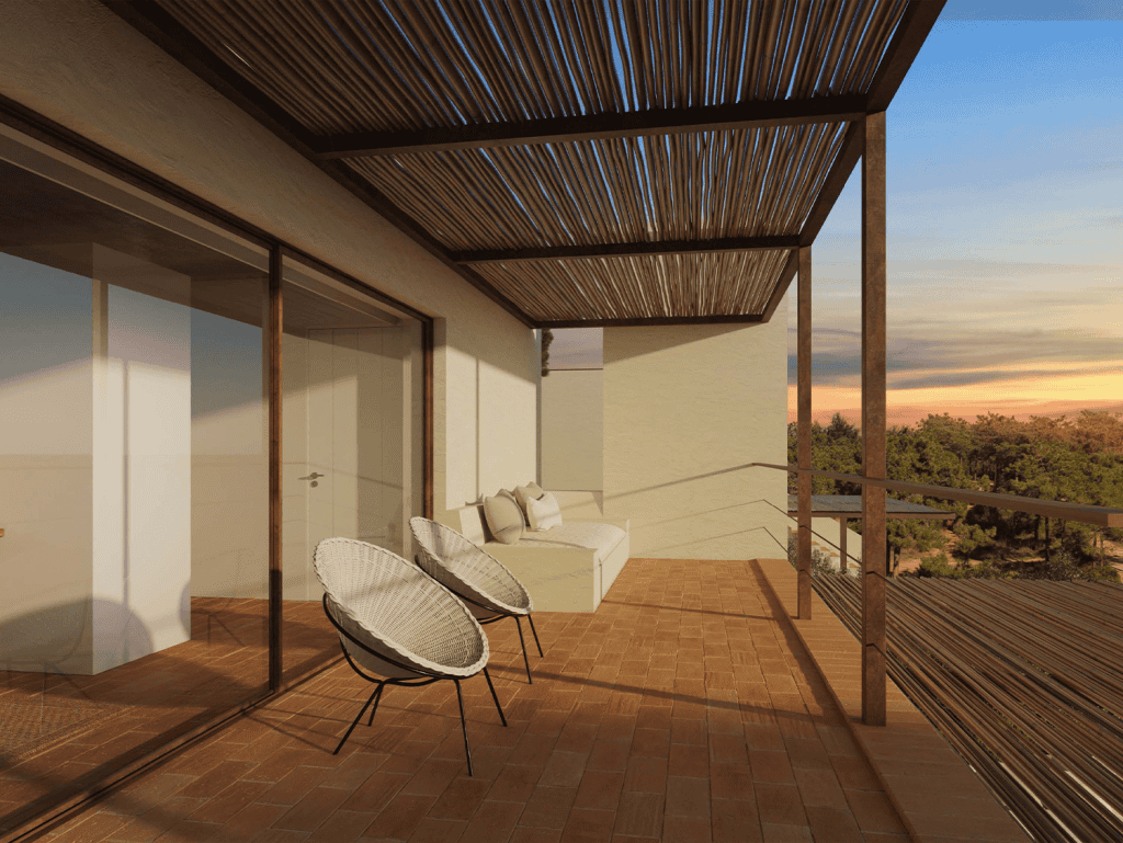 Balcony with outdoor chairs and sofa overlooking Ferragudo village in Algarve, Portugal.
