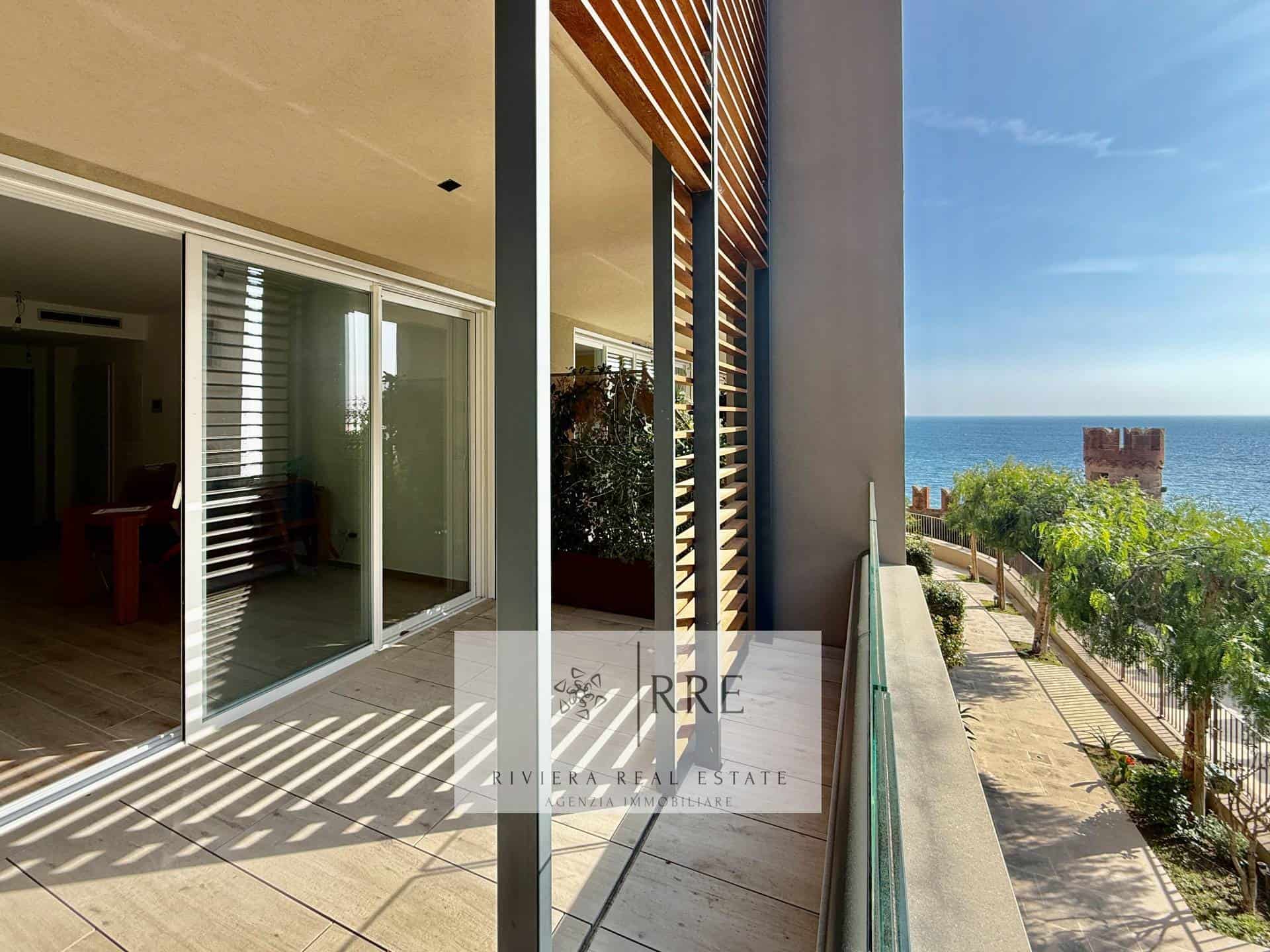 Beachfront apartment with sea views and outdoor terrace.