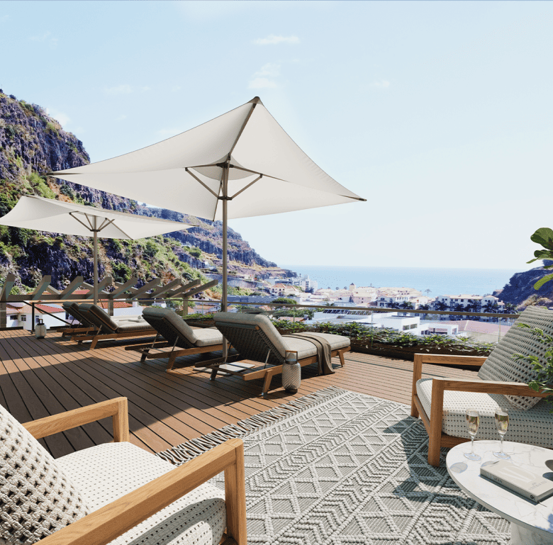 Outdoor terrace with sea view, loungers, and umbrellas in Ribeira Brava, Madeira, Portugal.