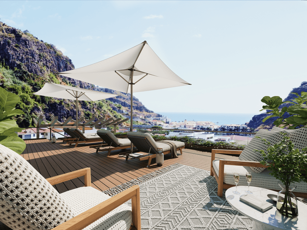 Outdoor terrace with sea view, loungers, and umbrellas in Ribeira Brava, Madeira, Portugal.