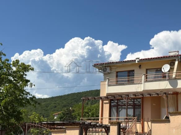 Two-storey house with balcony near the sea in Kosharitsa, Bulgaria.
