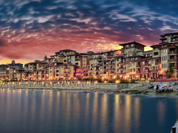 Beautiful view of Sveti Vlas waterfront with colorful buildings and calm sea at sunset.