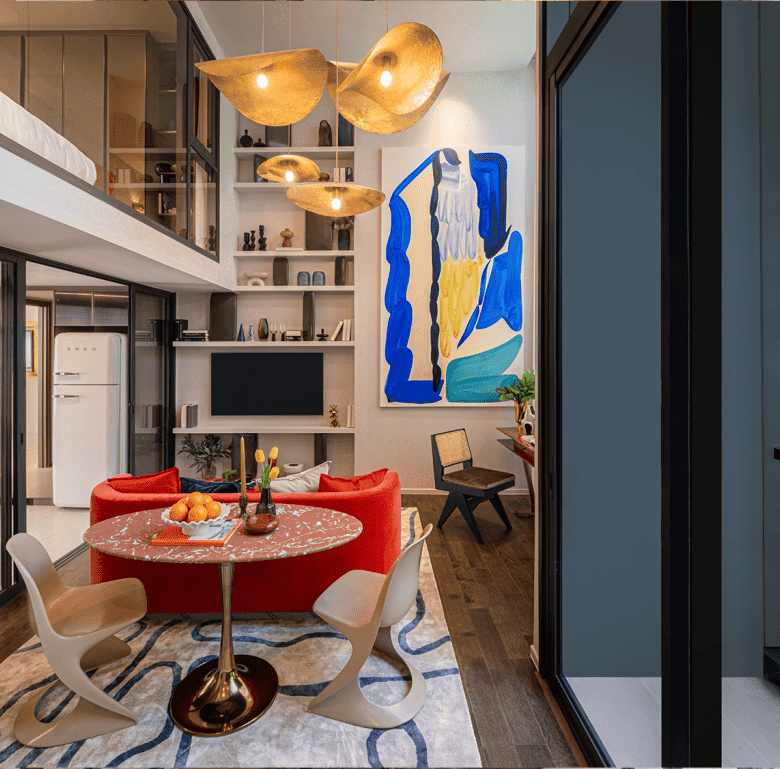 Contemporary Bangkok apartment interior featuring modern furniture, artwork, and natural light.