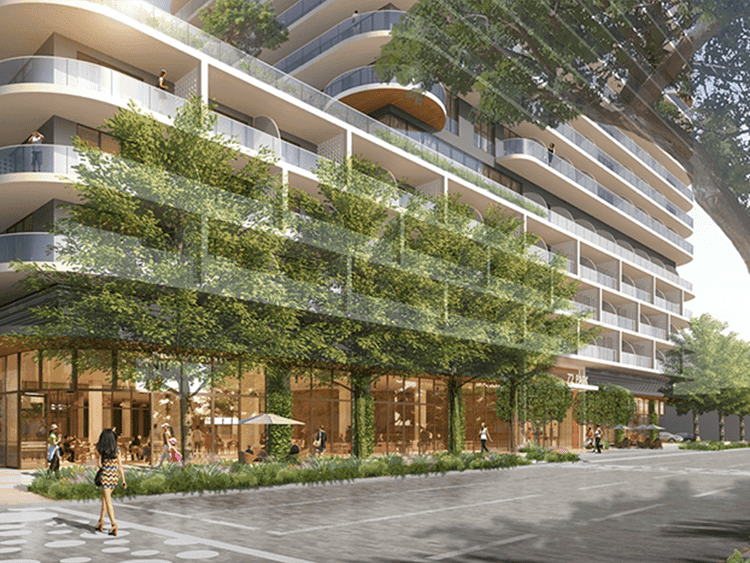 Modern Miami residential building with lush greenery and spacious balconies.