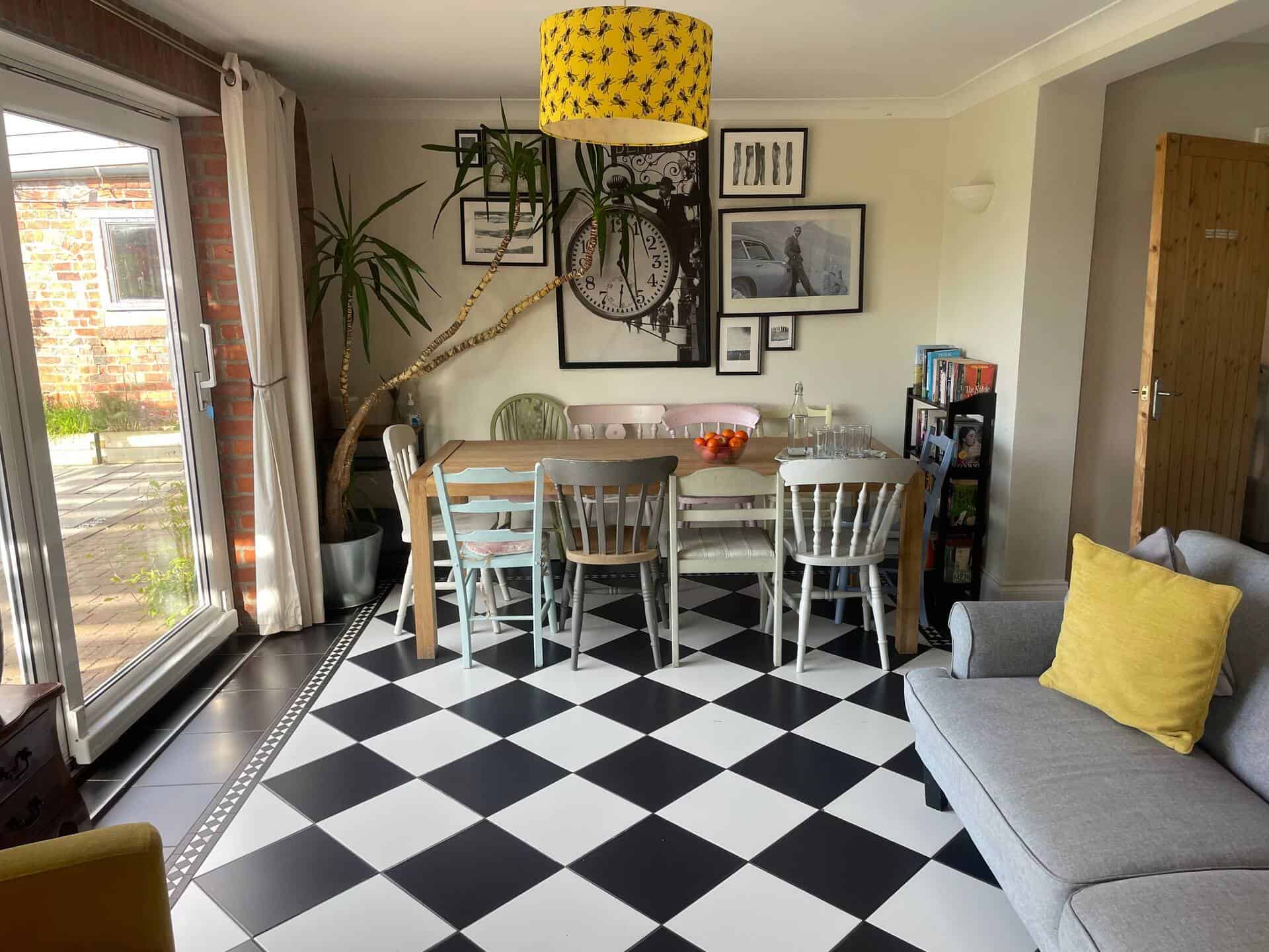 Modern dining room with stylish decor and natural light Bright dining area with contemporary furniture and artwork, perfect for family meals and gatherings.