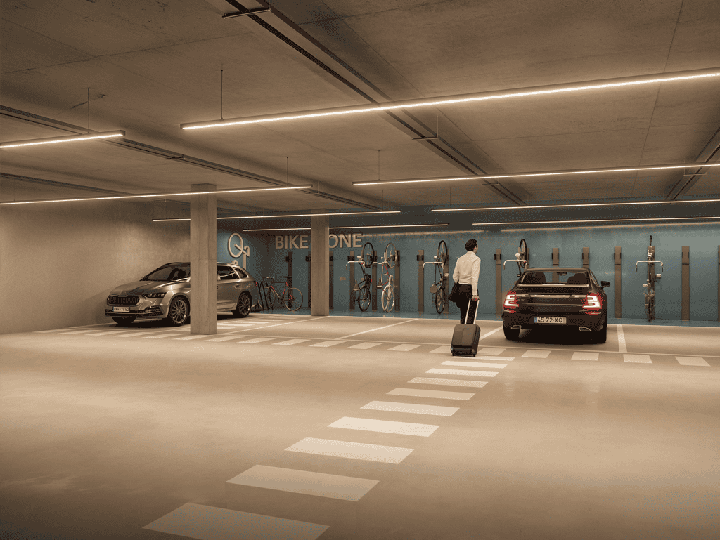 Underground parking facility in Lisbon featuring cars, bicycles, and modern lighting.