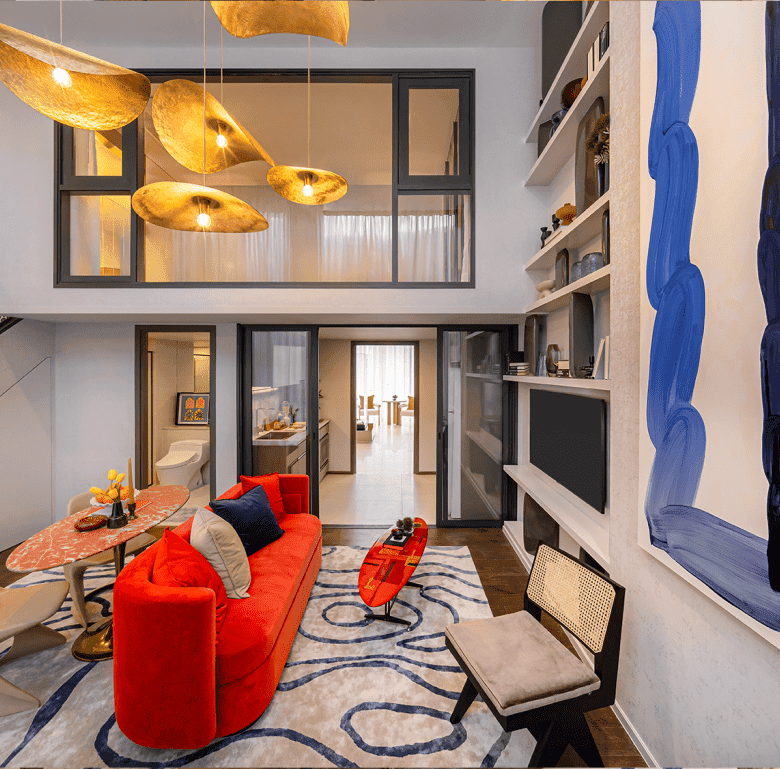 Bright, stylish living space in Bangkok with contemporary furniture and colorful artwork.