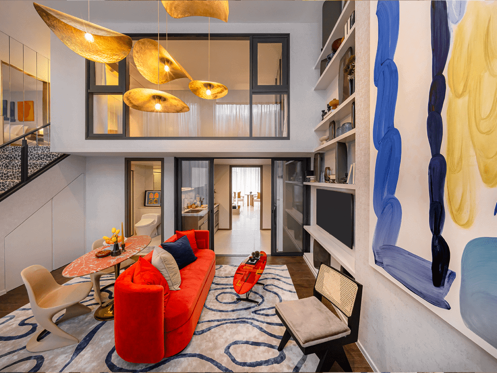 Bright, stylish living space in Bangkok with contemporary furniture and colorful artwork.