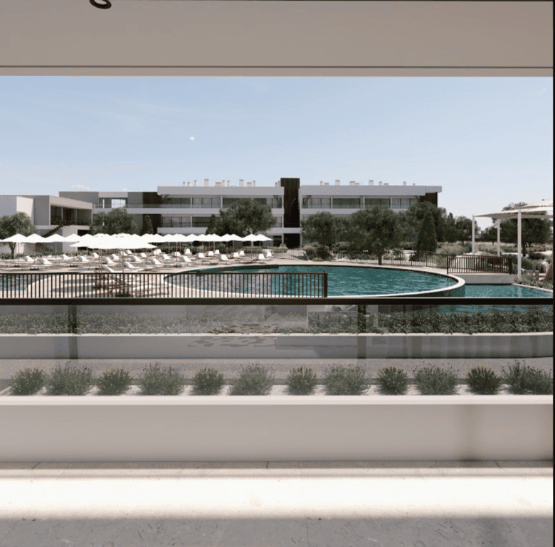 View of a luxurious swimming pool and modern apartments in Algarve, Portugal.