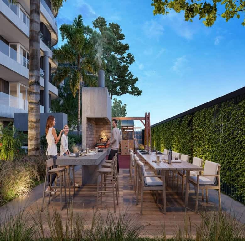 Outdoor dining space with modern furniture and lush greenery in Montevideo, Uruguay.