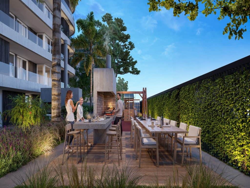 Outdoor dining space with modern furniture and lush greenery in Montevideo, Uruguay.