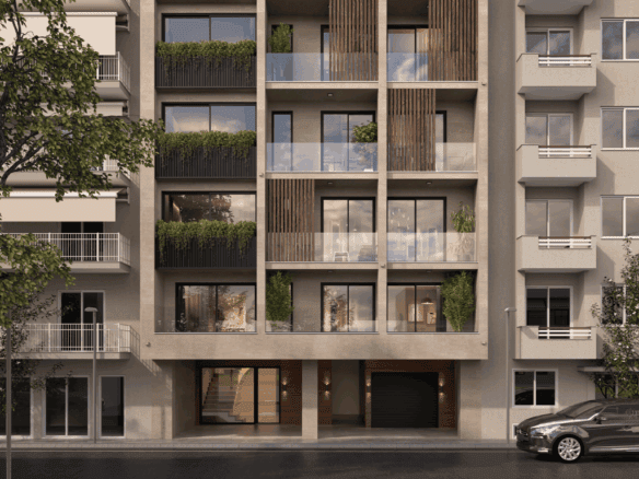 Modern apartment building in Koukaki, Athens with balconies and lush greenery.