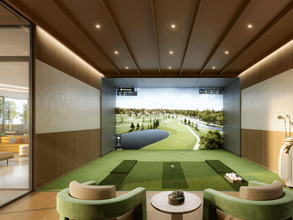 Indoor golf simulation room with large screen and seating area.
