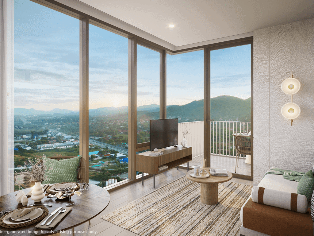 Bright living space with floor-to-ceiling windows showcasing scenic landscape.