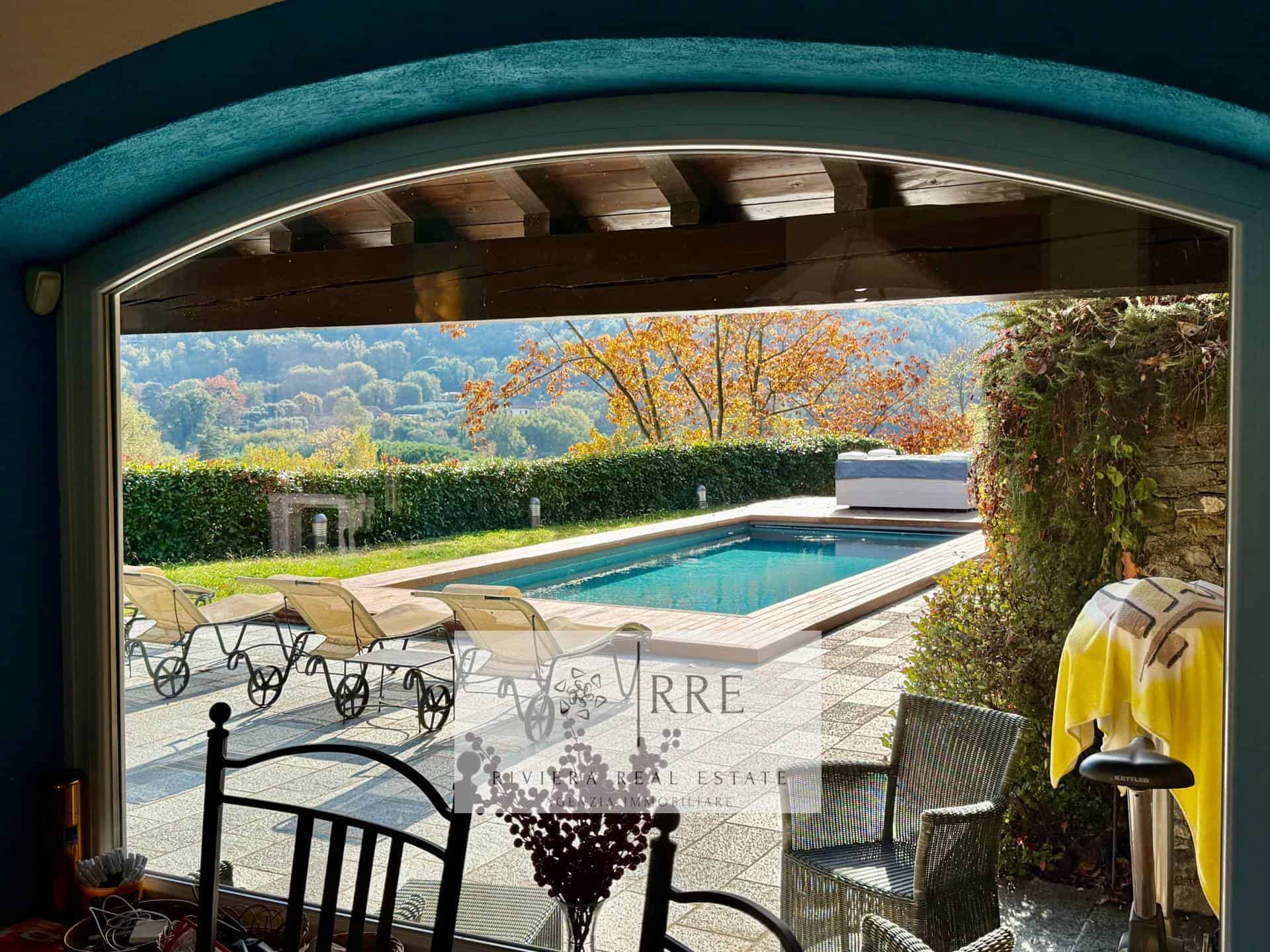 Outdoor swimming pool overlooking scenic mountain landscape.