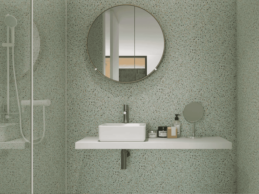 Contemporary bathroom in Porto, Portugal, featuring a sleek sink, round mirror, and minimalist desig.