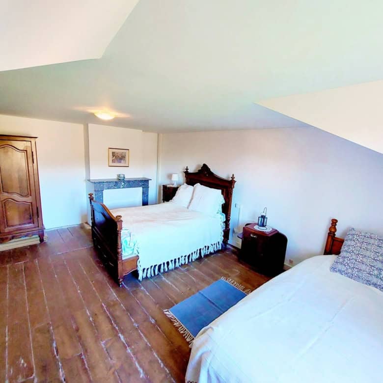 Charming farmhouse bedroom with traditional wooden furniture in Madiran, France. Perfect for a peace.